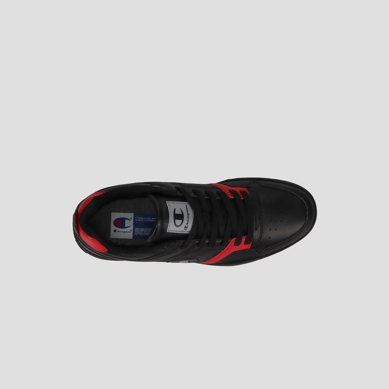 Top view of the Champion Men's 3-on-3 Court Low sneaker in black with red accents, black laces, and a Champion logo label on the gray tongue, shown against a plain light gray background.
