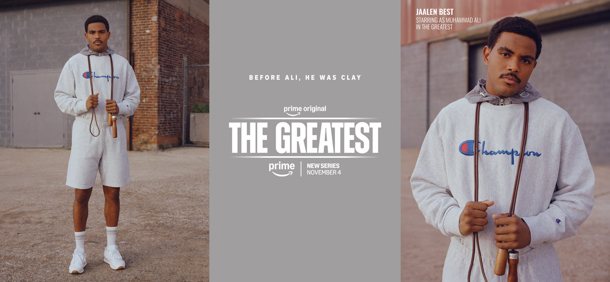 Promotional poster for the Prime Original series 'The Greatest' featuring actor Clay Davis in two photos wearing a white Champion hoodie and shorts, with text and the Prime logo on a gray background.