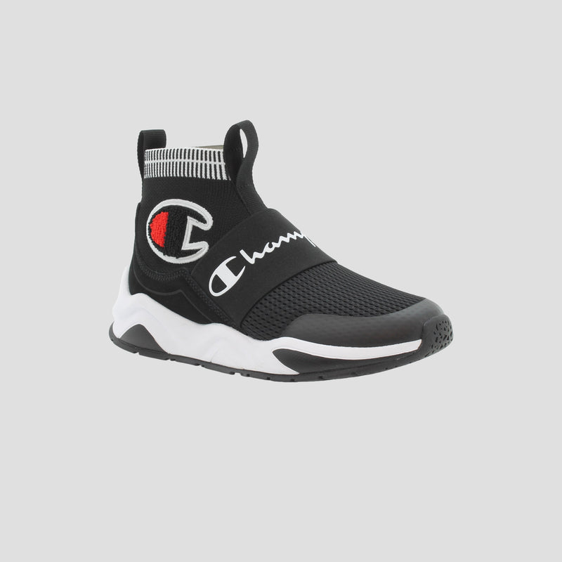 The Champion Kids' Rally Pro features a black mesh slip-on design with white and red logo details, a white and black sole, and a sock-style ankle collar for a modern kids' sneakers look.