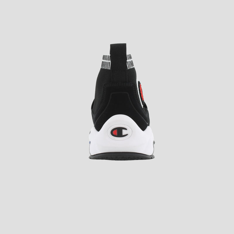 Back view of the Champion Kids' Rally Pro sneaker in black and white knit, with a pull tab and Champion logo on the heel, set against a plain light gray background.
