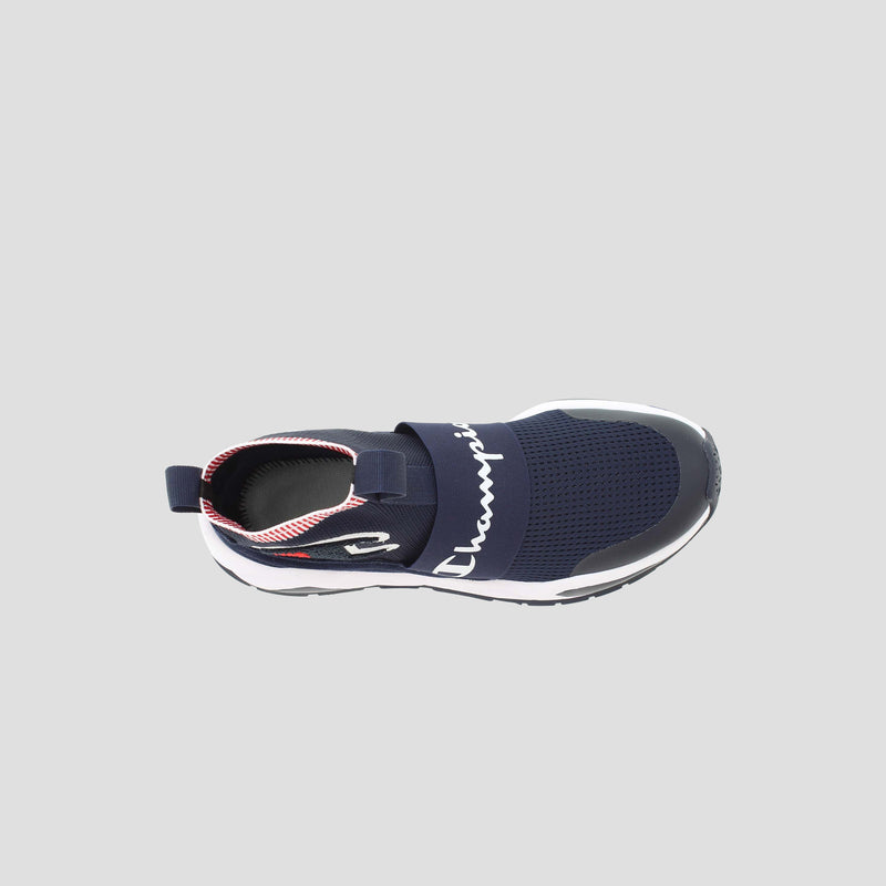 Top view of the Champion Men's Rally Pro sneaker, a navy blue slip-on with white sole, black elastic strap featuring "Champion" in white, sock-style ankle, and red and white interior accents.