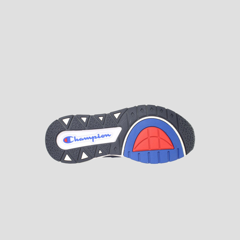 The image displays the sole of the Champion Men's Rally Pro sneaker, highlighting a geometric tread pattern, blue and red Champion logo, and colorful heel accents—ideal for men's high-top sneaker fans. The background is light gray.