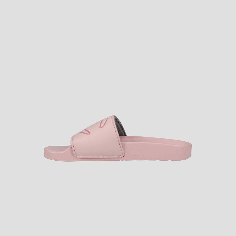 The Champion Women's IPO Slide is a light pink sandal featuring a wide strap and contoured footbed, displayed in side view against a plain white background.