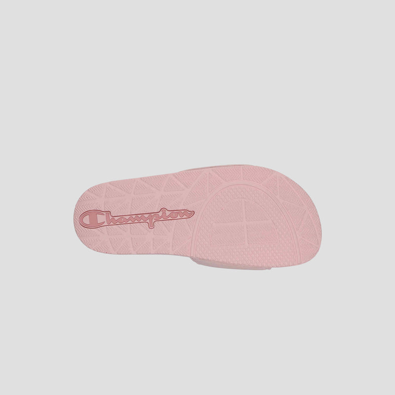 The Women's IPO Slide by Champion features a pink sole with "Champion" in red script, a textured grip pattern, and a contoured footbed for both style and comfort.