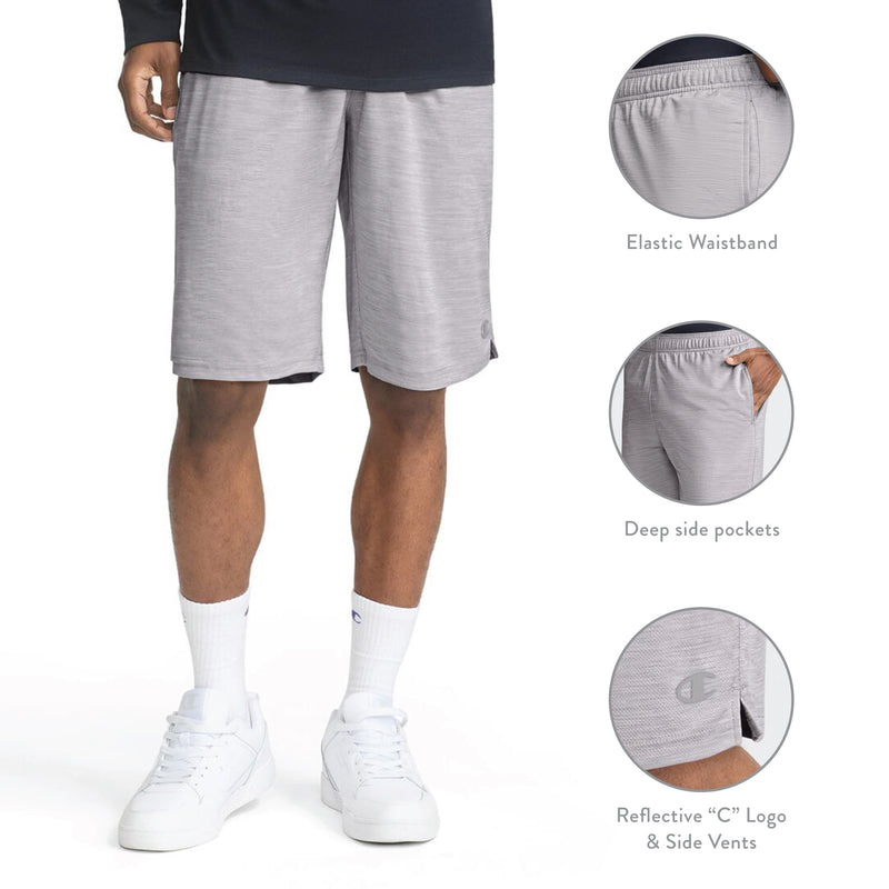 A man is wearing Champion 10″ Moisture Wicking Sport Shorts in light gray, paired with a dark shirt, white crew socks, and white sneakers. Insets highlight features including an elastic waistband, deep side pockets, reflective C logo, and side vents. These performance training shorts are crafted with moisture-wicking fabric to keep you comfortable throughout every workout.