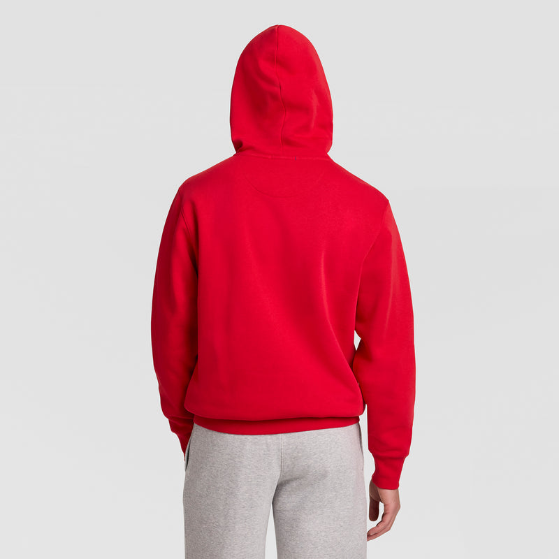 Back view of a person wearing a red Powerblend Hoodie, C Logo and grey sweatpants.