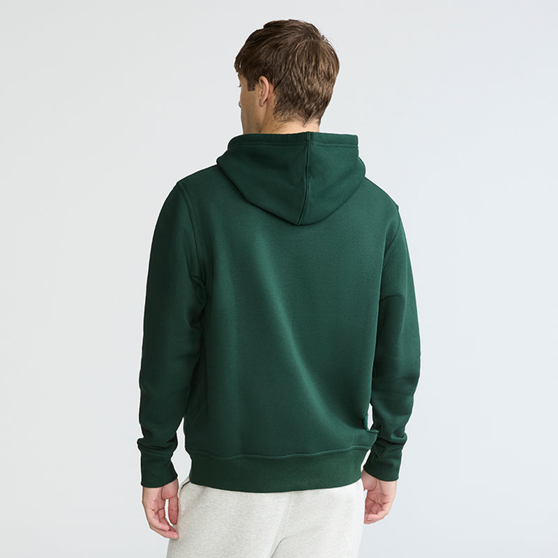 Person wearing a green hoodie on a white background