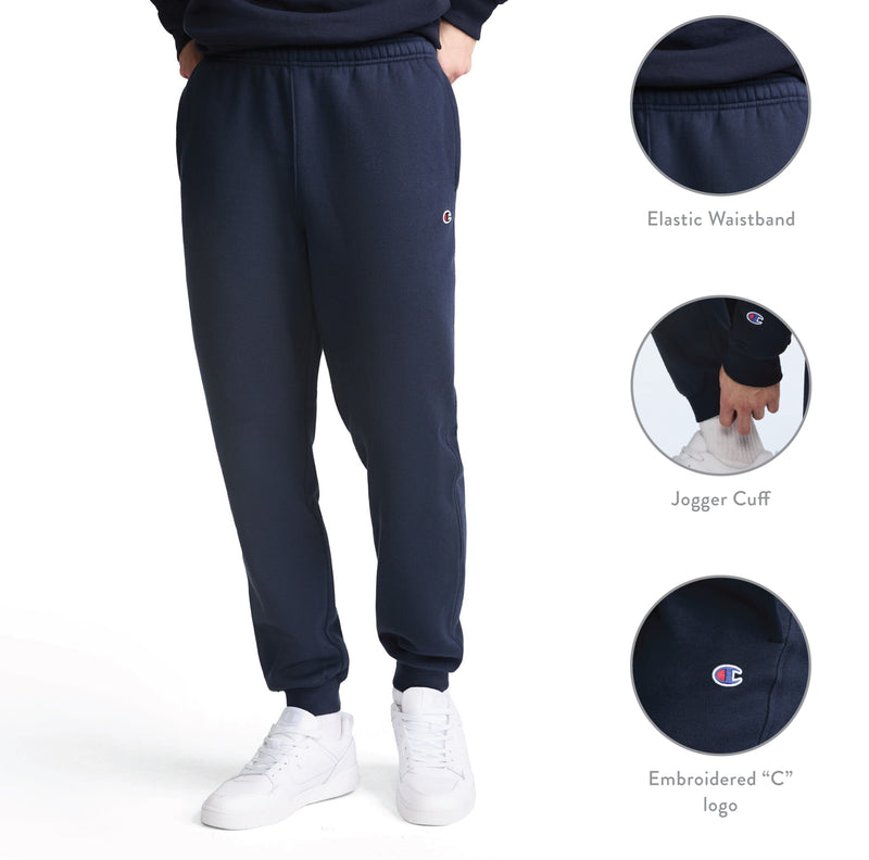 A person wears Champion Powerblend Joggers with a small embroidered C logo, featuring an elastic waistband and jogger cuffs. Designed for comfort, these men’s fleece pants offer warmth and softness. Three circular insets highlight the waistband, cuff, and logo details. Shown on a white background.