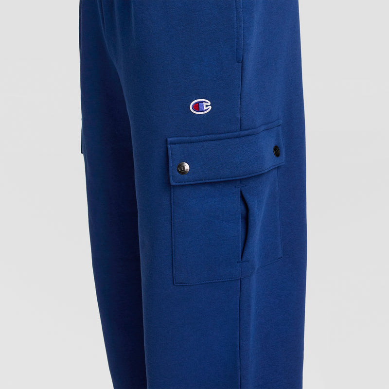 Close-up of Champion’s Fleece Cargo Pant, featuring a blue fleece design with a snap-button cargo pocket and an embroidered C Logo above it—ideal for upgrading your men’s streetwear collection.