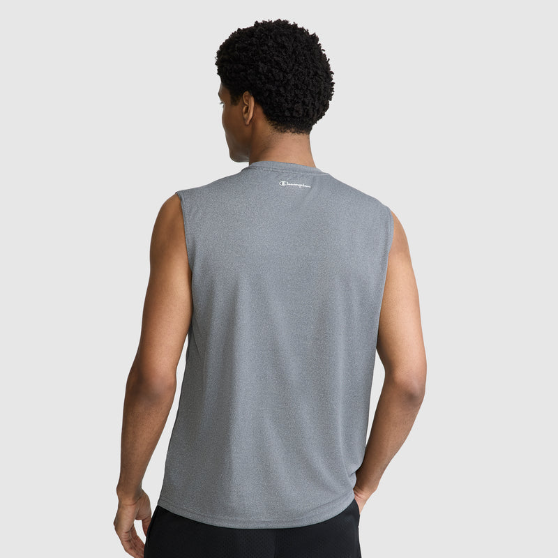A man seen from behind wears a Champion Sport Muscle Tank with a reflective C logo and black shorts, standing against a plain light background.