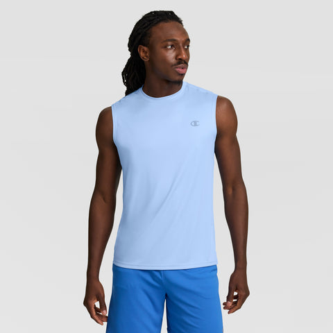 A man stands against a light gray background, modeling the Champion Sport Muscle Tank with Reflective C Logo—a comfortable, moisture-wicking workout shirt for men in light blue.