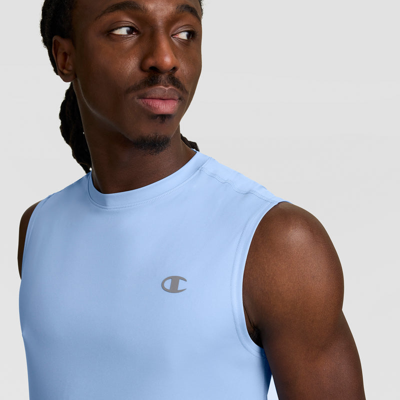 A man wears the Champion Sport Muscle Tank with Reflective C Logo in light blue, looking to the side against a plain background and highlighting this moisture-wicking men’s workout shirt.