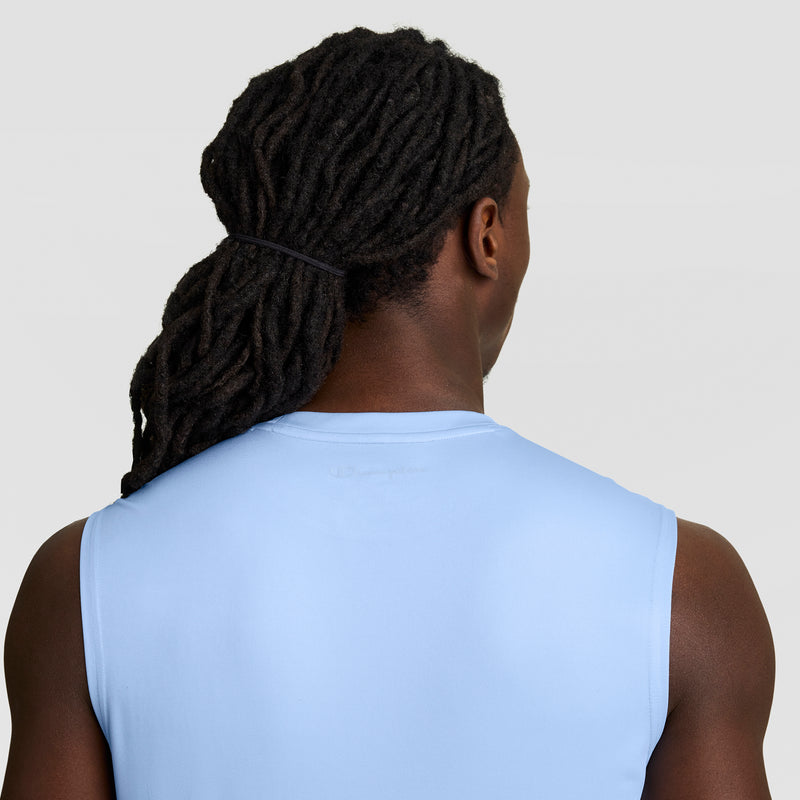 A person with long, dark dreadlocks tied back is seen from behind wearing the Champion Sport Muscle Tank with a Reflective C Logo against a plain, light background.