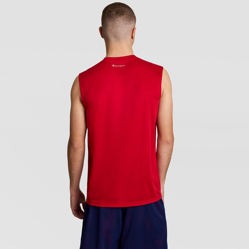 A person stands with their back to the camera, wearing a Champion Sport Muscle Tank featuring a Reflective C Logo and navy blue shorts, set against a plain light gray background.