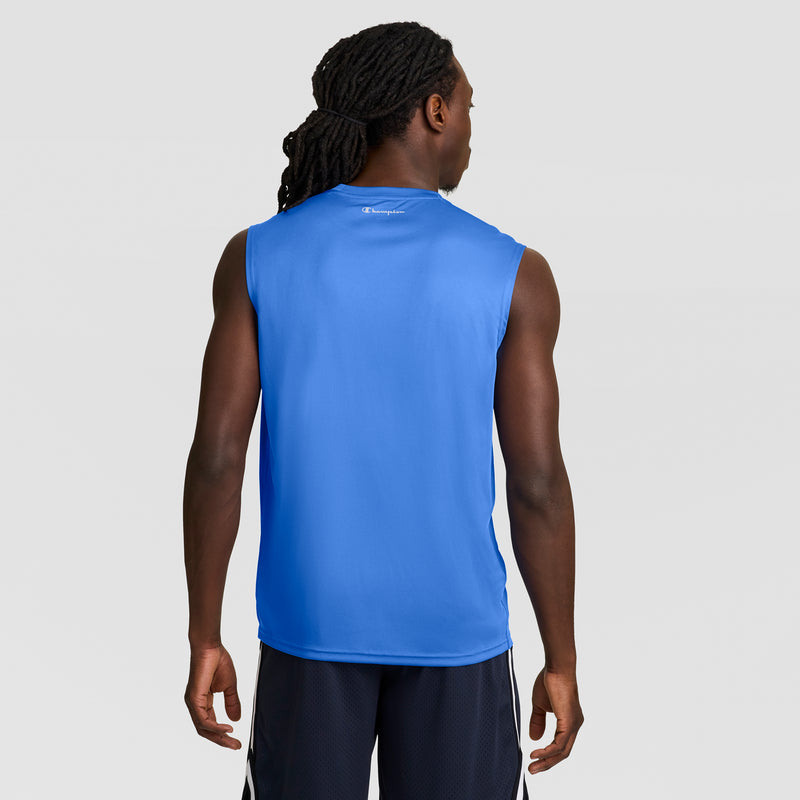 A man with long braided hair, wearing the Champion Sport Muscle Tank with a Reflective C Logo and black shorts, stands facing away from the camera against a plain light gray background.