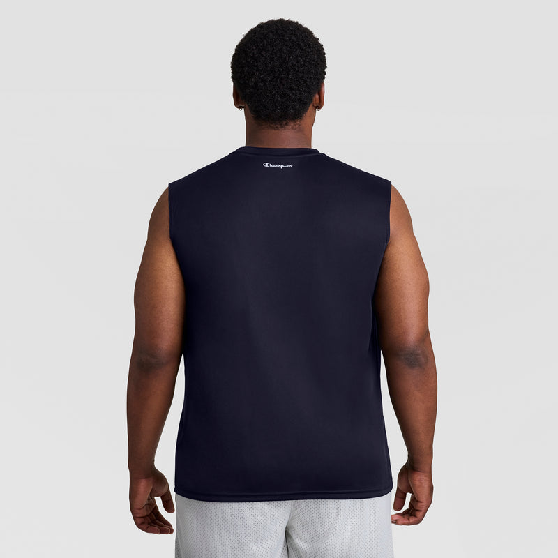 A man faces away from the camera, wearing a Champion Sport Muscle Tank with Reflective C Logo - Big & Tall, paired with light gray athletic shorts, set against a plain light background.