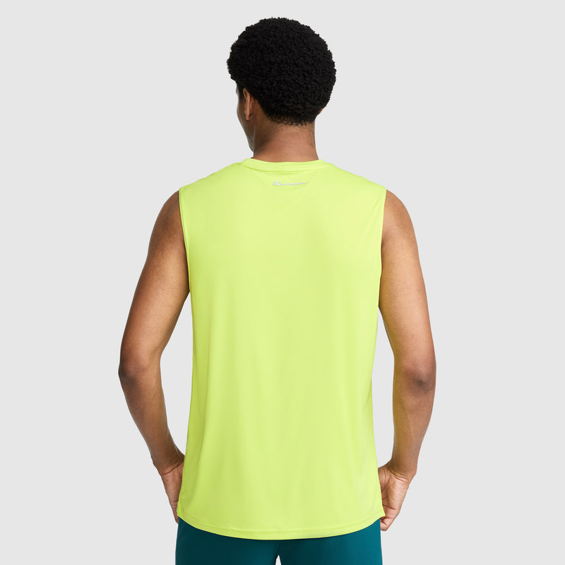 A person stands facing away, wearing the Champion Sport Muscle Tank with Reflective C Logo in neon yellow and dark teal shorts against a plain light gray background. The tank features moisture-wicking fabric, making it perfect for staying cool during intense workouts.