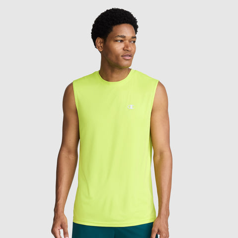 A man stands against a plain gray background, looking to his left with a neutral expression, wearing the Champion Sport Muscle Tank featuring a reflective C logo on the chest. The sleeveless design in bright yellow-green offers moisture-wicking comfort, making it ideal for intense workouts.