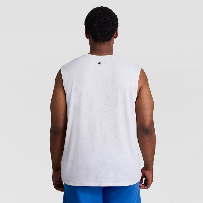A person is standing with their back to the camera, wearing a Champion Big & Tall C Logo Muscle Tank in light gray and blue shorts, set against a plain light background.