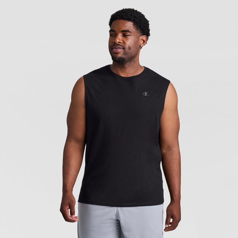 A man faces forward in a Champion Muscle Tank, C Logo - Big & Tall (black, small chest logo) and light gray shorts, set against a plain light gray background.