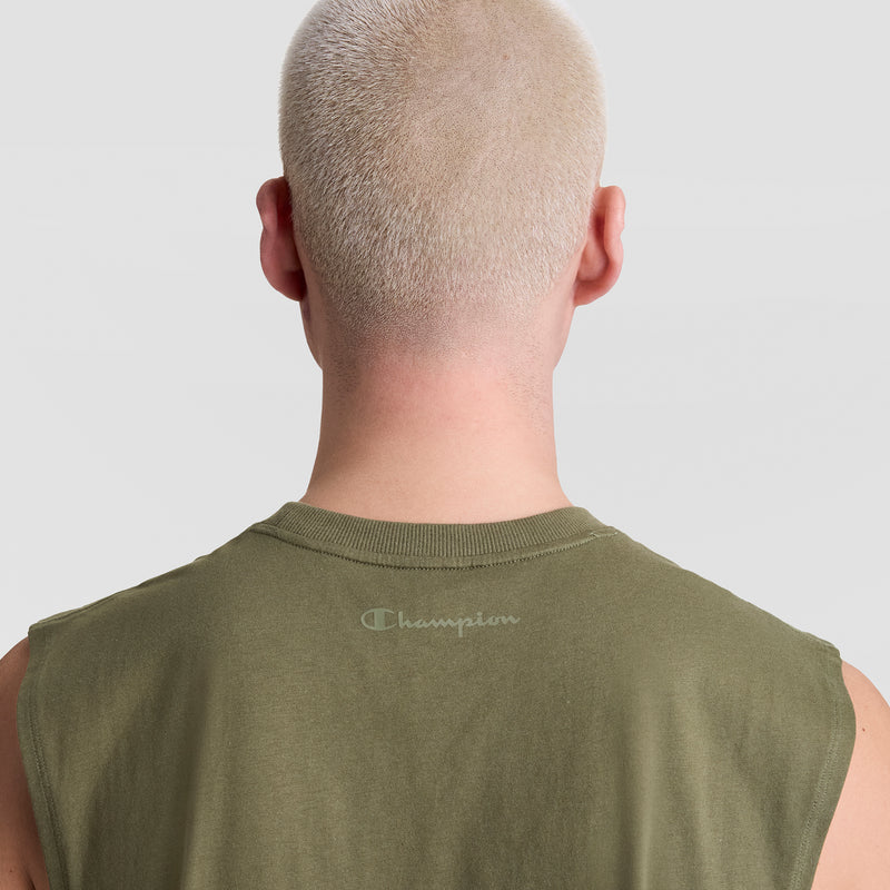 A person with closely cropped platinum blond hair is seen from behind wearing Champion’s olive green Muscle Tank, featuring the C Logo on the upper back, set against a plain light gray background.