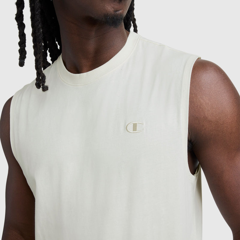 A person in a sleeveless, light-colored Champion Muscle Tank (C Logo), shown from shoulders to mid-torso against a plain light gray background.