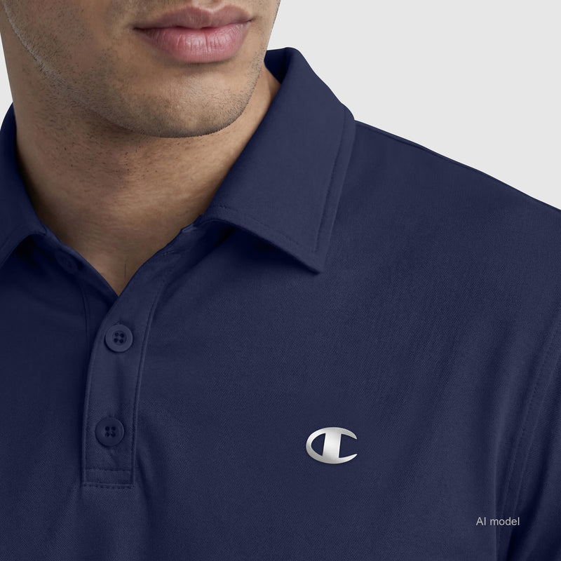 A man wearing the Champion Sport Polo, C Logo, in navy blue is shown from the shoulders up against a plain light background.