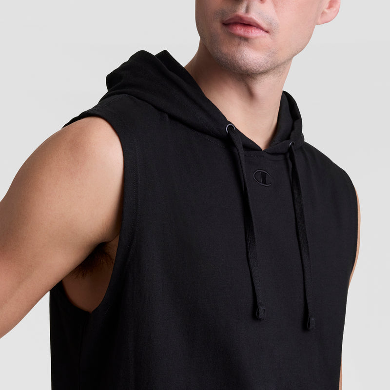A person wearing the Champion Sleeveless Hoodie with C Logo, shown from the shoulders up against a plain light background.