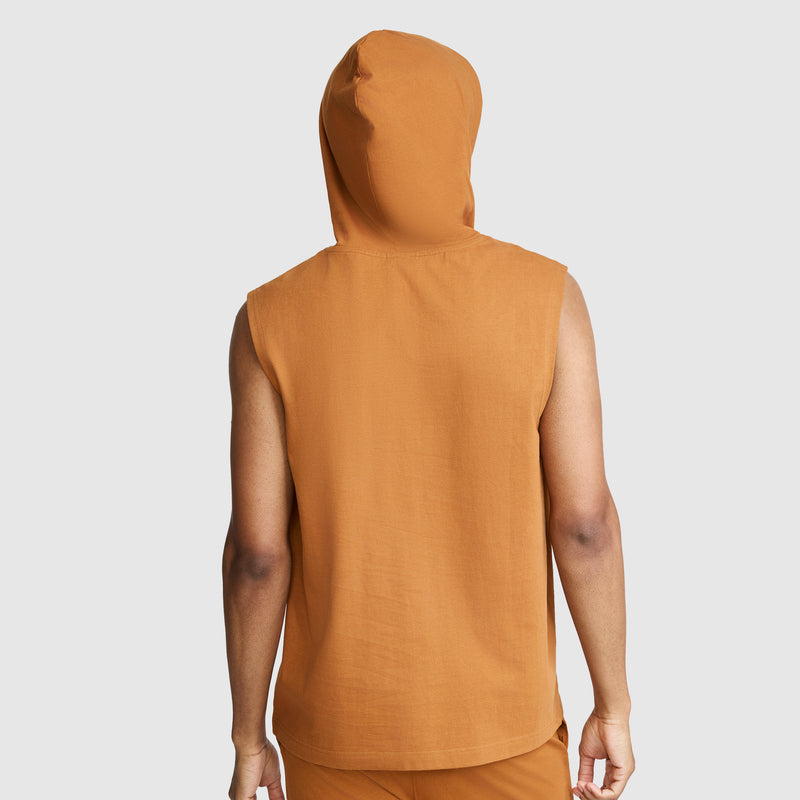 A person is shown from the back against a plain, light background wearing the Champion Jersey Sleeveless Hoodie, C Logo, paired with matching orange pants crafted from soft ring-spun cotton.
