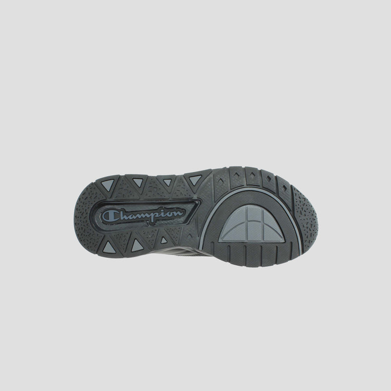 The image displays the bottom view of the Kids' Rally Pro high-top sneaker by Champion in black, highlighting textured sole patterns and a prominent Champion logo at the center.