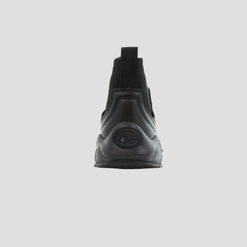 The Champion Kids' Rally Pro is a black high-top sneaker shown from the back on a plain light background, featuring a raised sole and a bold circular Champion logo on the heel.