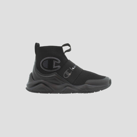 The Champion Kids' Rally Pro is a black slip-on athletic sneaker featuring a thick sole, mesh upper, elastic strap, and Champion logos—ideal comfortable footwear for everyday play.