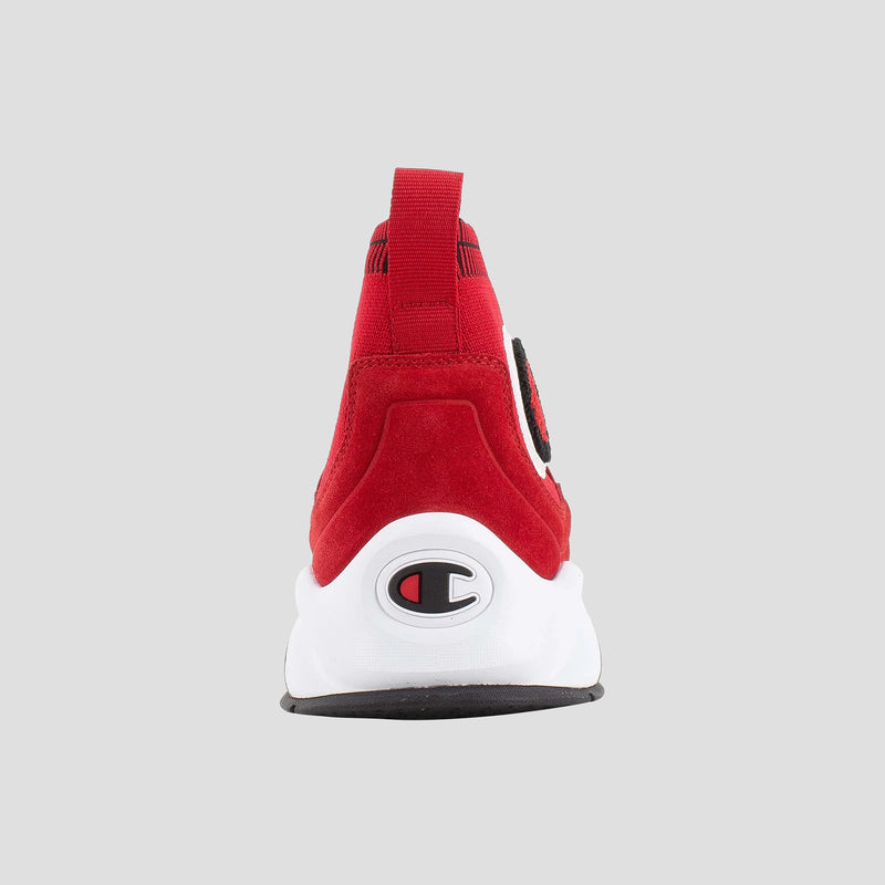 Rear view of the Champion Kids' Rally Pro high-top sneaker in red, featuring a white sole, black outsole, red pull tab, and Champion logo on the heel against a light gray background.