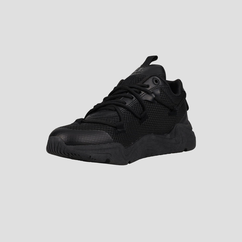 The Champion Men's Hyper C Pilot W, a black lifestyle sneaker with a durable mesh upper, thick sole, and lace-up design, is displayed against a plain gray background.