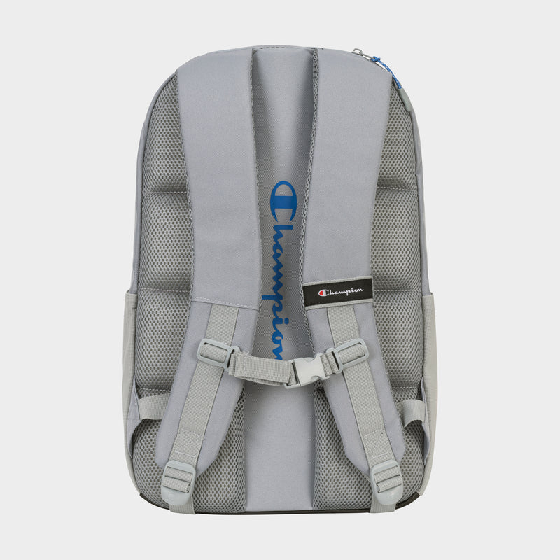 The Champion Summit Backpack in gray is shown from the back, with padded straps, mesh padding for comfort, a chest buckle, a padded laptop sleeve, and the blue Champion logo printed vertically on one strap.