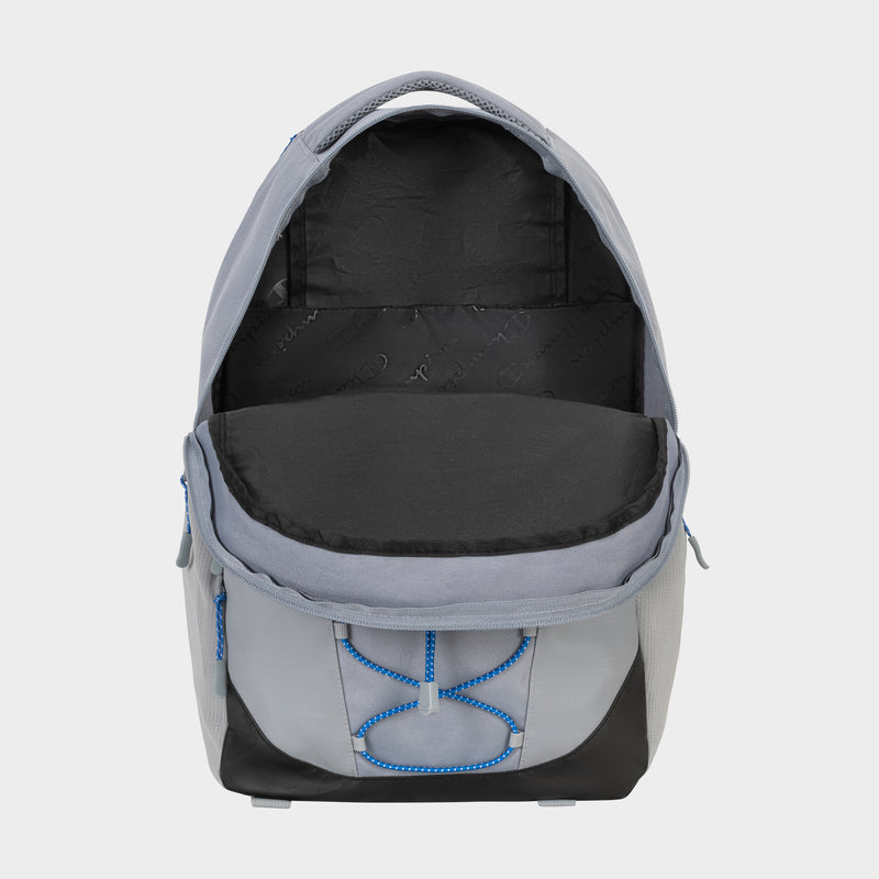 The Champion Summit Backpack in gray and black with blue accents is open, showing a spacious black-lined main compartment, padded laptop sleeve, top handle, side pockets, and weather-resistant design.