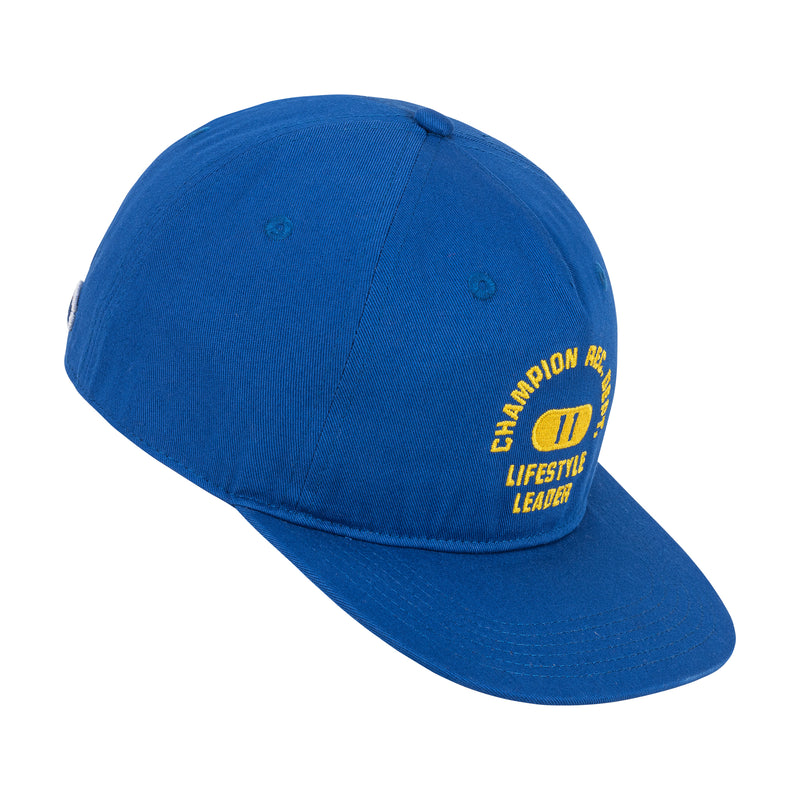 The Champion Athletic Dept Flat Brim Cap - 2 Pack features a blue cap with yellow "CHAMPION APPAREL" and "LIFESTYLE LEADER" text, plus a yellow oval graphic on the front. Shown angled on a white background.