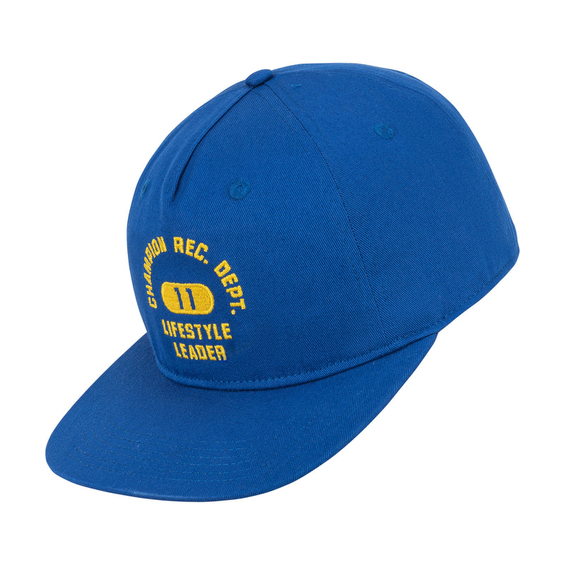 A Champion Athletic Dept Flat Brim Cap (2 Pack) in blue with yellow "CHAMUNDA REC. DEPT. 11 LIFESTYLE LEADER" embroidery on the front, shown angled on a white background.