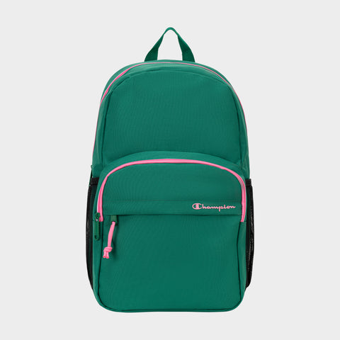 A green Luna Backpack by Champion with pink zippers and logo features a minimalist design, including a front pocket, black mesh side pockets, a top handle, and an interior laptop sleeve. The streamlined backpack is displayed on a plain light background.