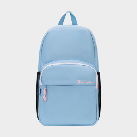 The Champion Luna Backpack is a light blue everyday backpack featuring a front zip pocket, pink zipper pulls, black side mesh pockets, and a top handle. Designed for convenience, it includes an interior laptop sleeve and showcases the word "Champion" embroidered in white and pink on the front pocket. This minimalist backpack blends style with functionality for daily use.