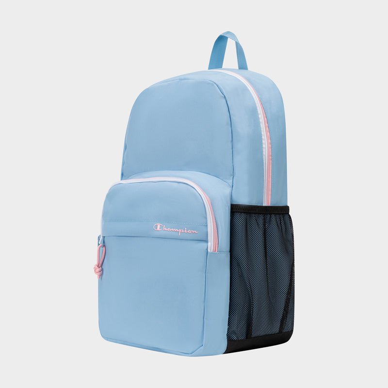 The Luna Backpack by Champion is a light blue minimalist backpack with pink zippers. It features a front pocket adorned with the embroidered Champion logo, a black mesh side pocket, and a top handle. Designed for everyday convenience, this backpack also includes a dedicated laptop sleeve. The product is displayed against a plain white background.