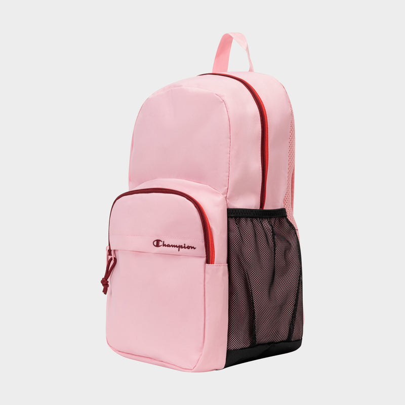 Light pink Luna Backpack by Champion with red zippers, a front pocket displaying the Champion logo, a black mesh side pocket, and a dedicated laptop sleeve, shown against a plain white background.