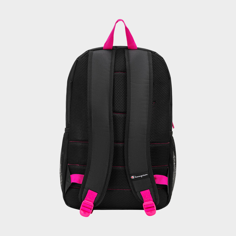 The Champion Kids' Merit Backpack features padded shoulder straps, pink accents on the top handle and adjusters, and mesh panels with the Champion logo on the lower back. It comes in black and is shown against a plain white background.