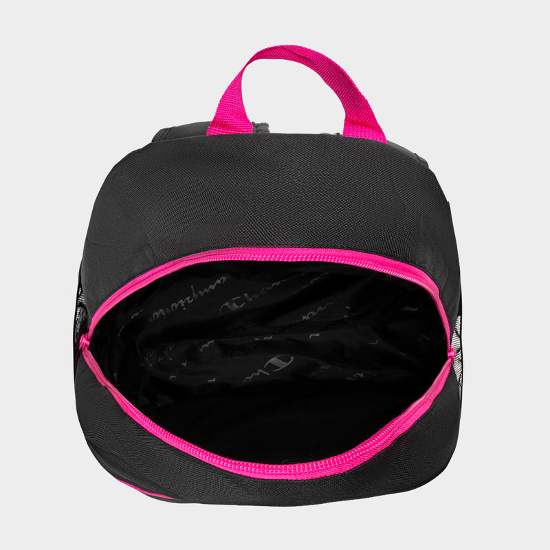 The Kids' Merit Backpack by Champion is shown from above in black with a bright pink zipper and handle, its zipper open to display the spacious, empty interior—ideal as a kids sports backpack.