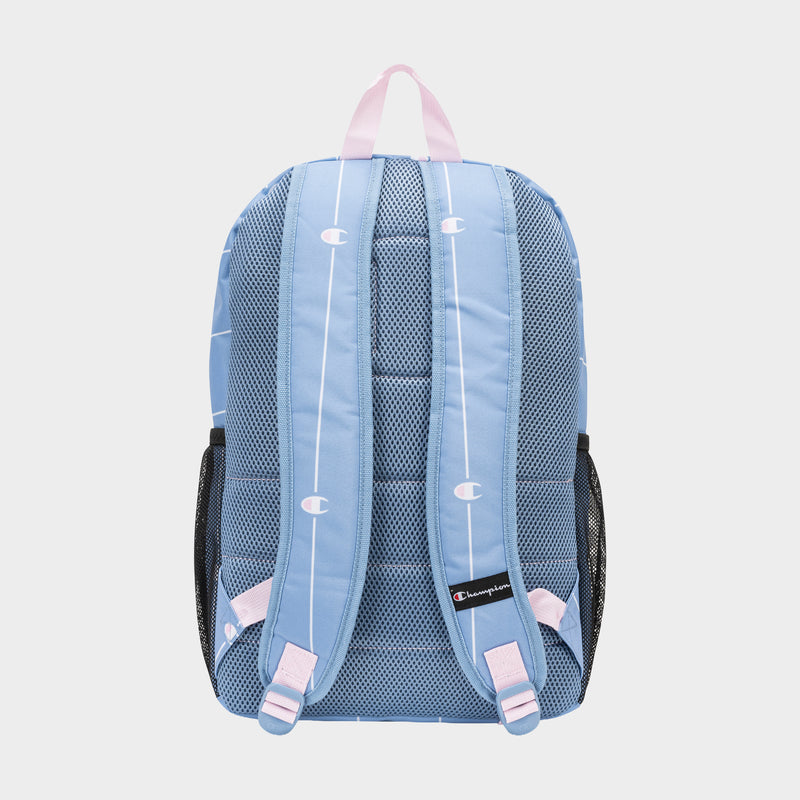 The Champion Kids' Merit Backpack is light blue with white vertical stripes, small logos, pink straps and handle, mesh padded back, black mesh side pockets, and an interior laptop sleeve.