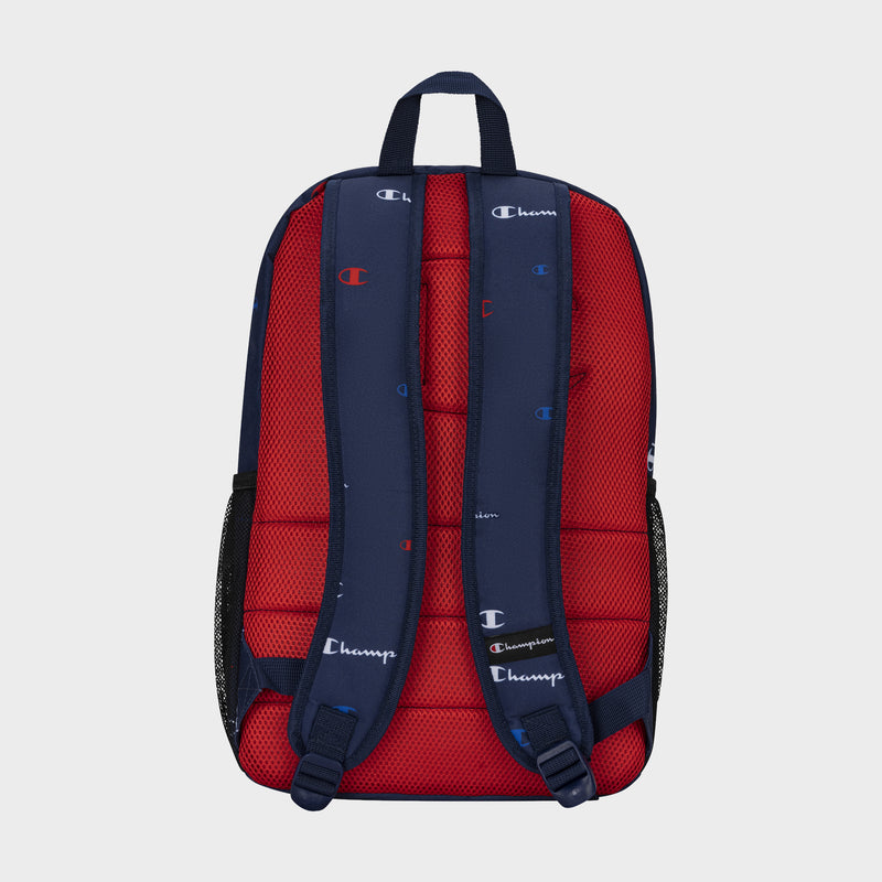 A navy blue and red Kids' Merit Backpack by Champion, shown from the back with padded, branded shoulder straps and mesh side pockets—an ideal, durable backpack for youth.