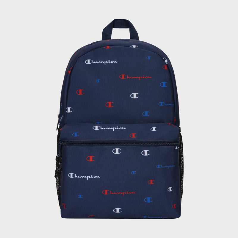 The Champion Kids' Merit Backpack in navy blue features a front zipper pocket, mesh side pockets, and a repeating white, red, and blue Champion logo pattern—combining durability with style for youth.