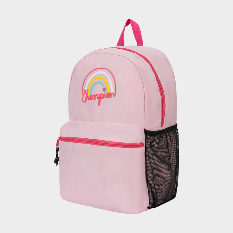 The Champion Kids' Merit Backpack is light pink polyester with a front zip pocket, black side mesh pocket, and pink handle. It features a rainbow design and embroidered "Champion" in pink—perfect for kids' sports.