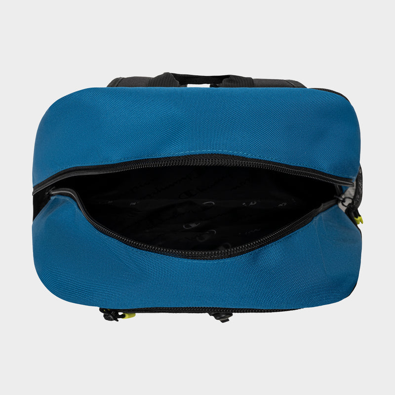 A top-down view of an open Champion Kid's Bungee Backpack with a blue exterior and black zipper, showing its empty black interior. The bag is displayed on a plain light gray background.