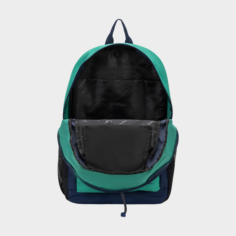 The Champion Kid's Bungee Backpack in green and navy is shown with its main compartment unzipped, revealing a black inner lining and pocket. Durable and perfect for kids’ sports, it also has a front pocket and side mesh pockets.